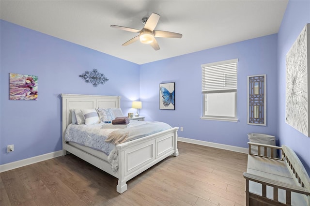 bedroom featuring ceiling fan and light hardwood / wood-style floors