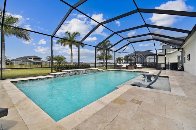 view of swimming pool with pool water feature, a hot tub, a lanai, an outdoor living space, and a patio