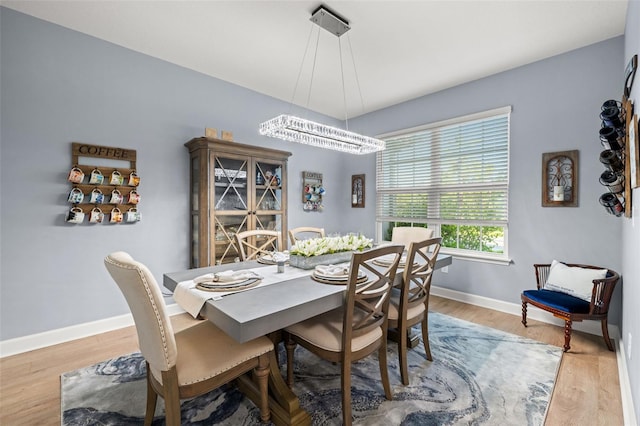 dining area with light hardwood / wood-style floors