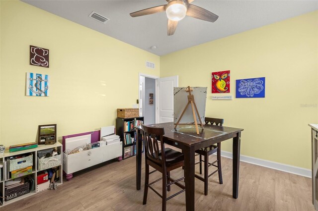 dining space featuring ceiling fan and light hardwood / wood-style floors