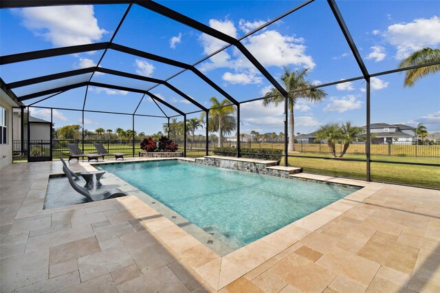 view of swimming pool with a patio, a lanai, and a lawn