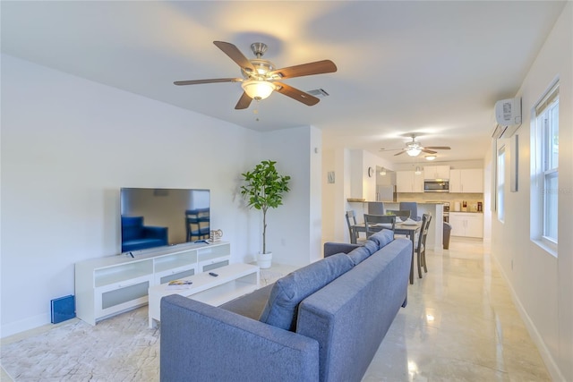 living room featuring a wall mounted air conditioner, ceiling fan, and light tile patterned floors