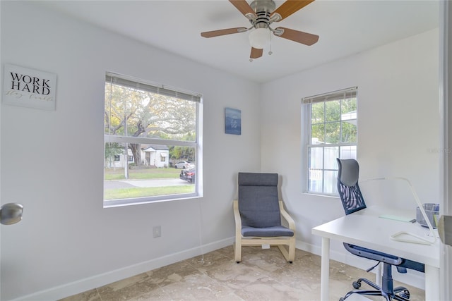 office area featuring plenty of natural light, light tile patterned flooring, and ceiling fan