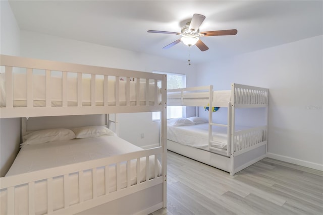 bedroom featuring light hardwood / wood-style flooring and ceiling fan