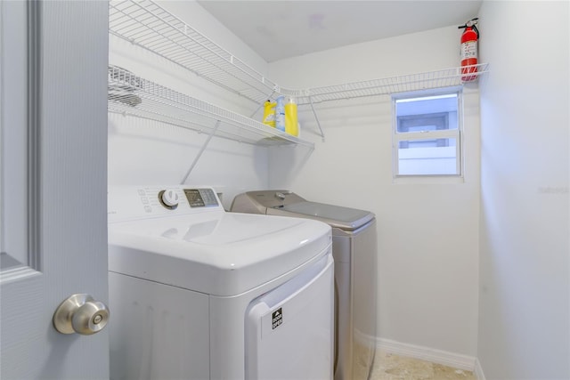 laundry room with washing machine and clothes dryer