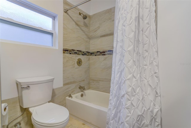 bathroom with toilet and shower / bath combination with curtain