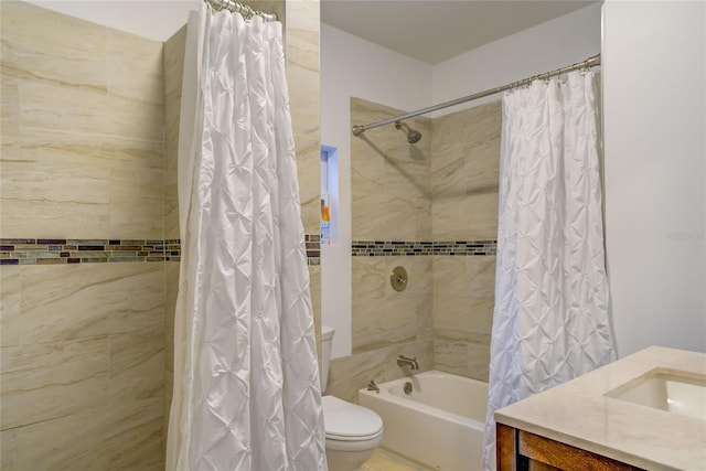 full bathroom featuring shower / tub combo, toilet, and vanity