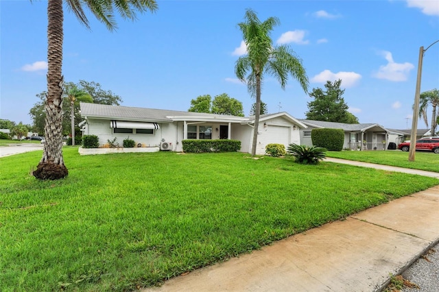 single story home with a garage and a front lawn