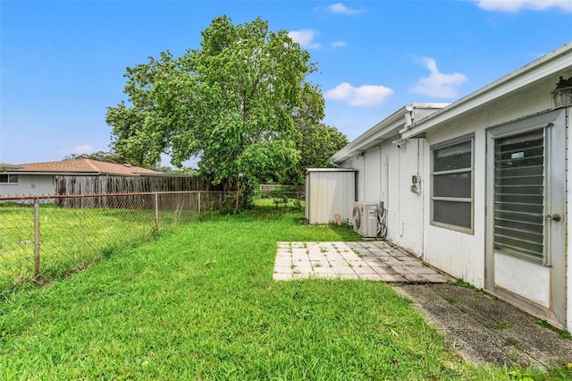 view of yard with ac unit and a patio area