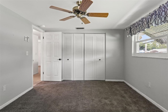 7015 Flaggler Dr, Port Richey, FL 34668 - unfurnished bedroom featuring carpet, baseboards, ceiling fan, visible vents, and a closet