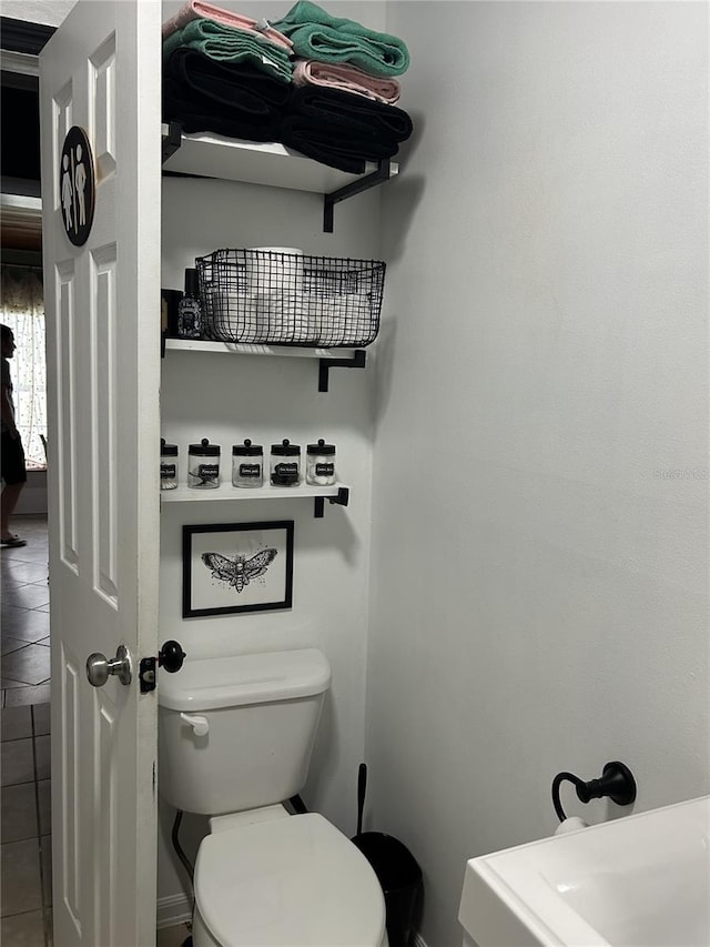 bathroom featuring tile patterned floors and toilet