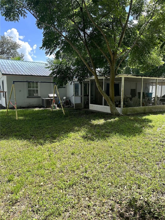 view of yard with central AC