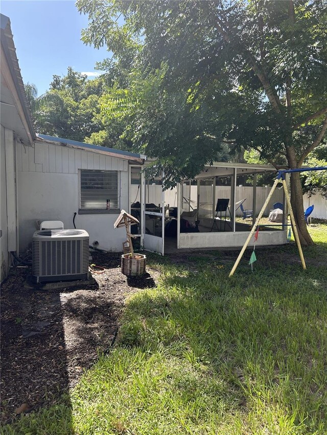 view of yard featuring cooling unit and a playground