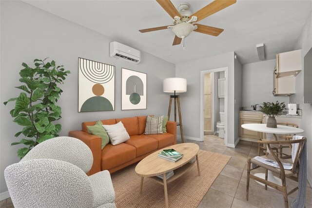 living room featuring light tile patterned floors, an AC wall unit, ceiling fan, and baseboards