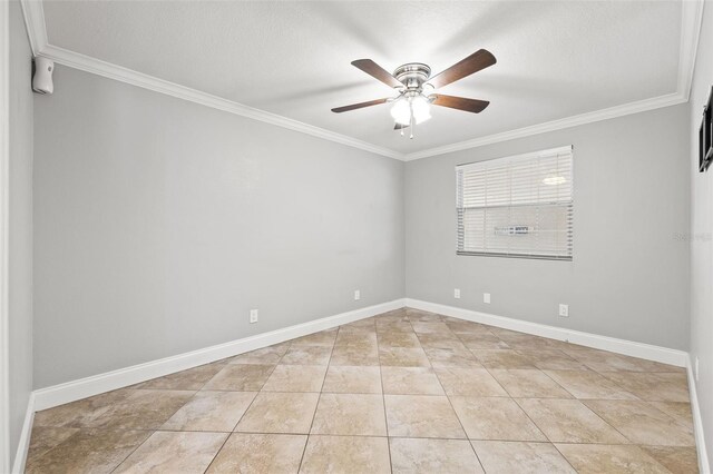 empty room featuring a textured ceiling, light tile patterned flooring, a ceiling fan, baseboards, and ornamental molding