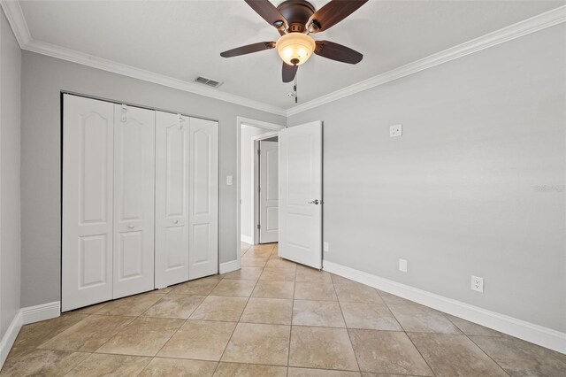 unfurnished bedroom with baseboards, visible vents, ornamental molding, and light tile patterned flooring