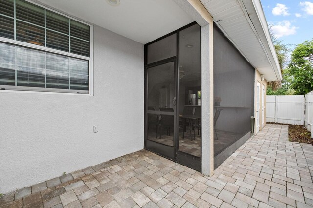 view of patio / terrace featuring fence