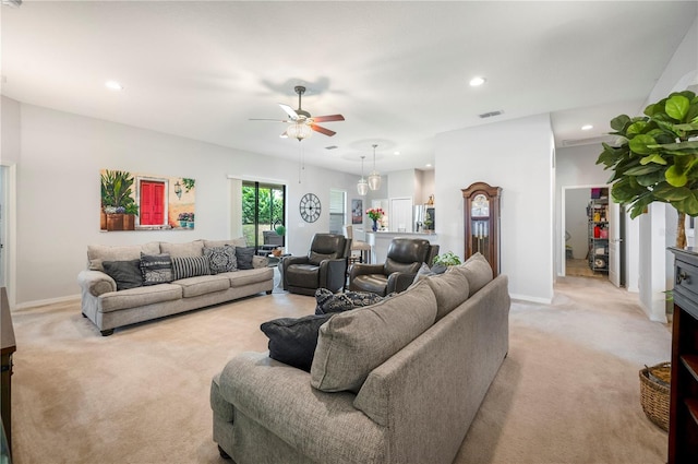 living room featuring light colored carpet and ceiling fan