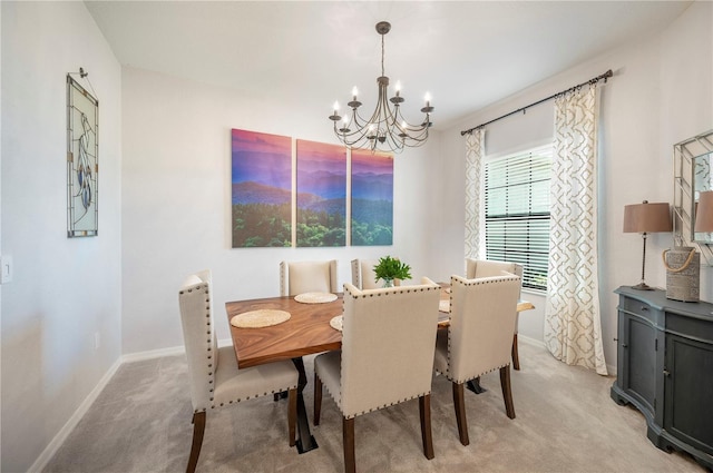 dining area with light carpet and a notable chandelier