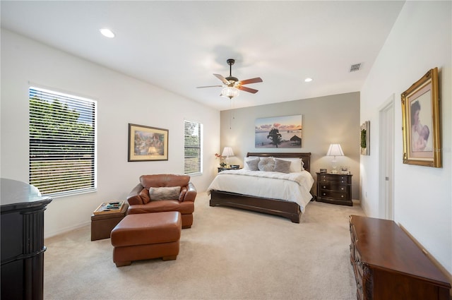 bedroom featuring ceiling fan and light colored carpet