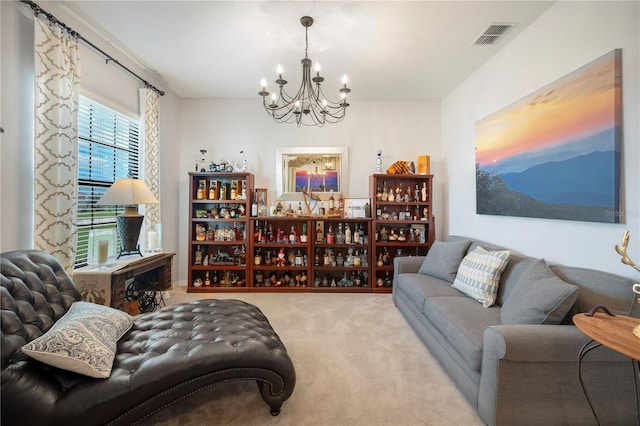 living room featuring a healthy amount of sunlight, a notable chandelier, and light colored carpet