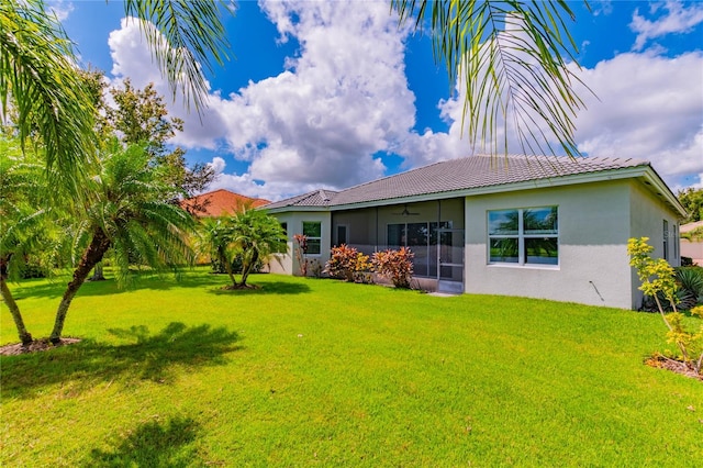 back of house featuring a yard