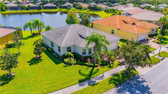 drone / aerial view with a water view