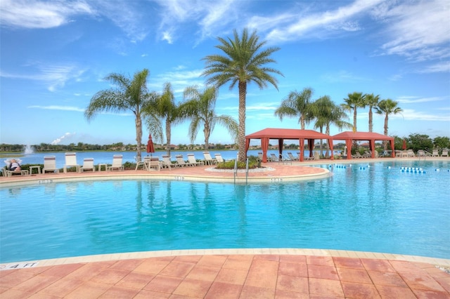 view of pool with a water view and a gazebo