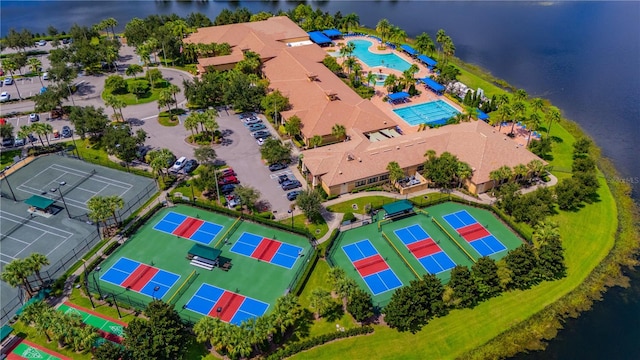 birds eye view of property with a water view