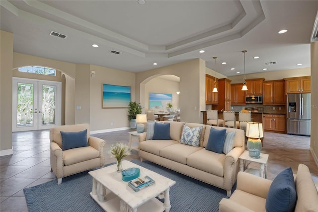 tiled living room featuring french doors