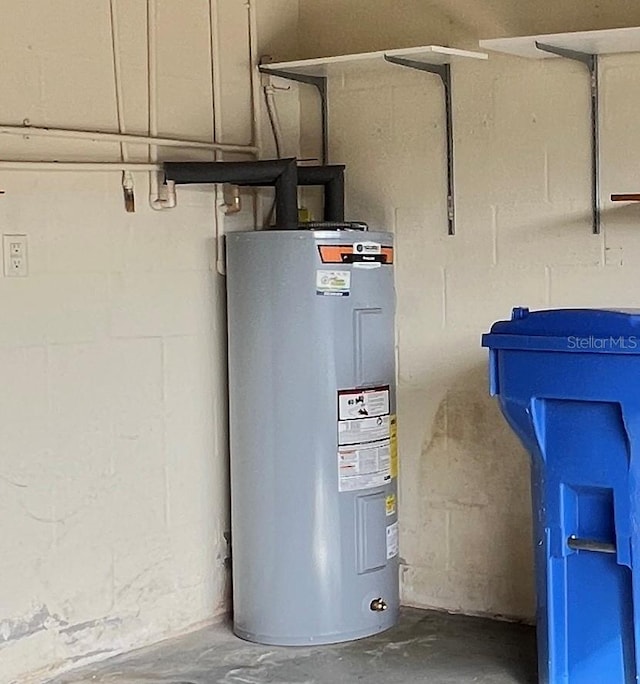 utility room featuring water heater