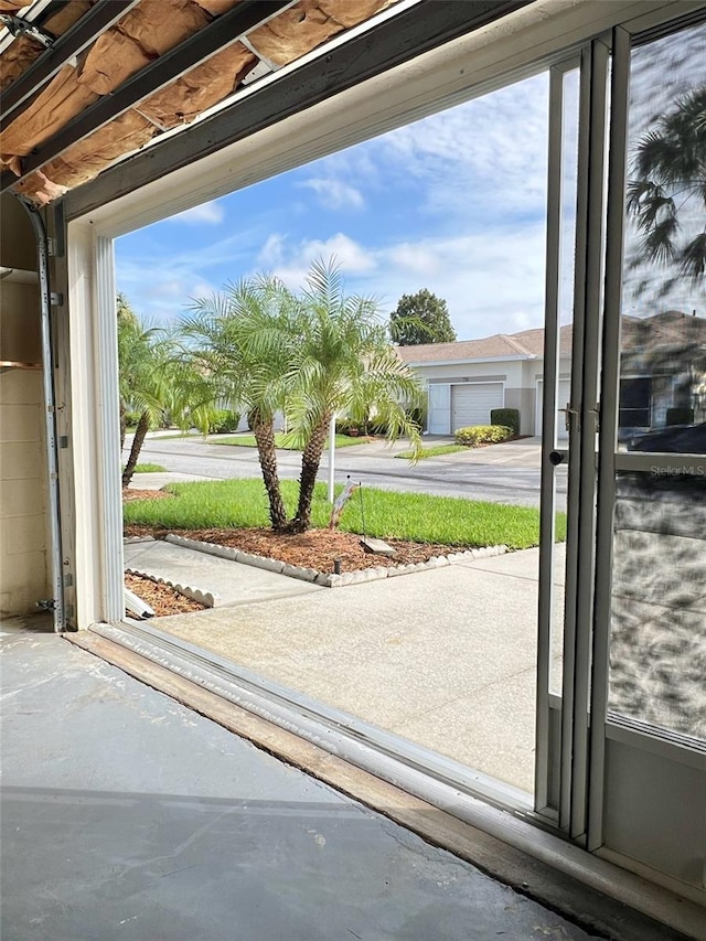 doorway to outside featuring concrete floors