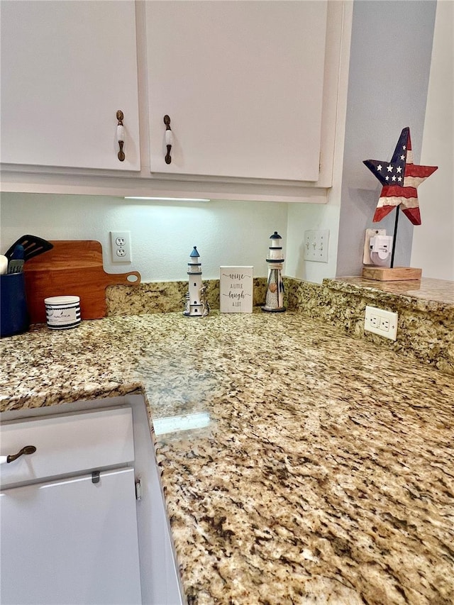 761 Tremont Greens Ln Unit 61, Sun City Center, FL 33573 - details featuring white cabinetry and light stone countertops