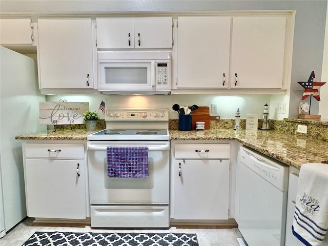 761 Tremont Greens Ln Unit 61, Sun City Center, FL 33573 - kitchen with white appliances, white cabinets, and light stone countertops