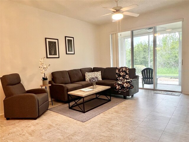 761 Tremont Greens Ln Unit 61, Sun City Center, FL 33573 - living area with a ceiling fan and a textured ceiling