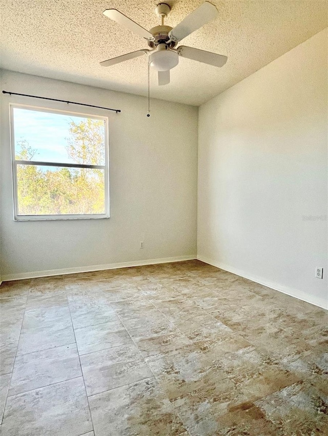 761 Tremont Greens Ln Unit 61, Sun City Center, FL 33573 - unfurnished room with baseboards, ceiling fan, and a textured ceiling