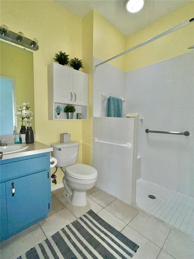 761 Tremont Greens Ln Unit 61, Sun City Center, FL 33573 - full bathroom featuring a walk in shower, vanity, toilet, and tile patterned flooring
