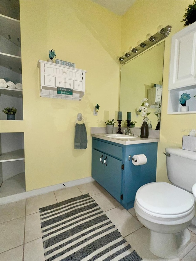 761 Tremont Greens Ln Unit 61, Sun City Center, FL 33573 - bathroom with vanity, toilet, and tile patterned flooring
