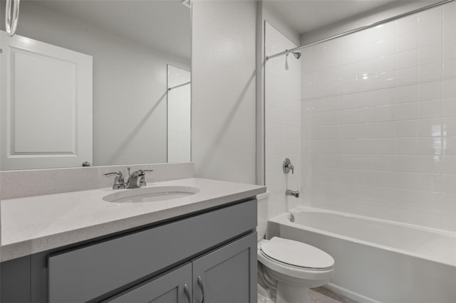 full bath featuring washtub / shower combination, vanity, and toilet