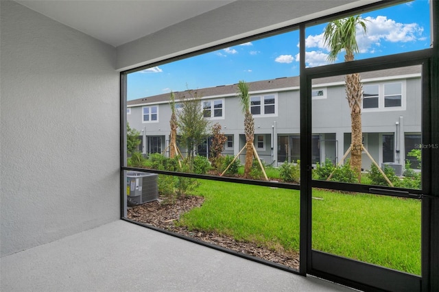 unfurnished sunroom featuring a residential view