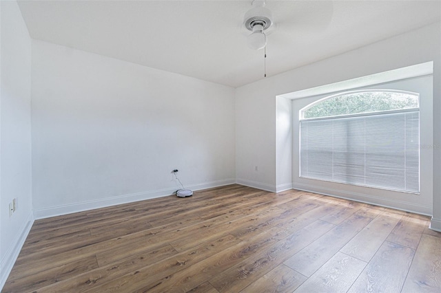 spare room with ceiling fan and hardwood / wood-style floors