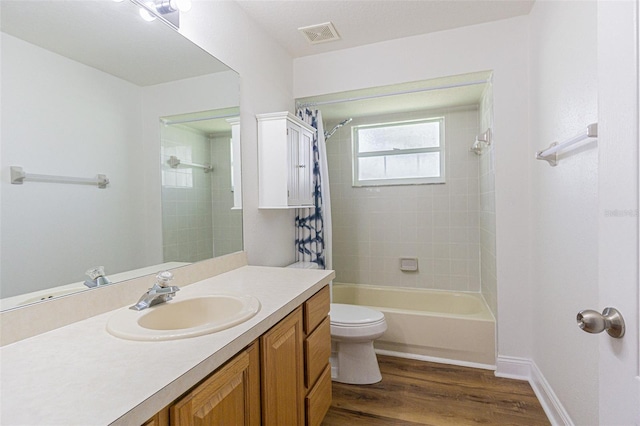 full bathroom featuring wood-type flooring, vanity, toilet, and shower / bath combo