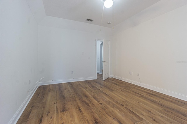 spare room with hardwood / wood-style floors