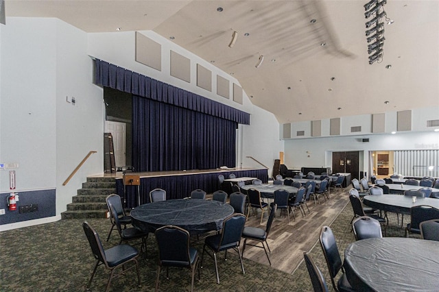 interior space featuring high vaulted ceiling and hardwood / wood-style flooring