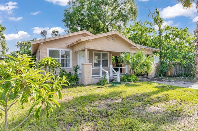 bungalow-style house with a front yard