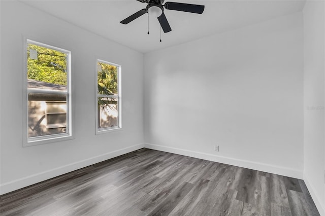 spare room featuring wood-type flooring and ceiling fan