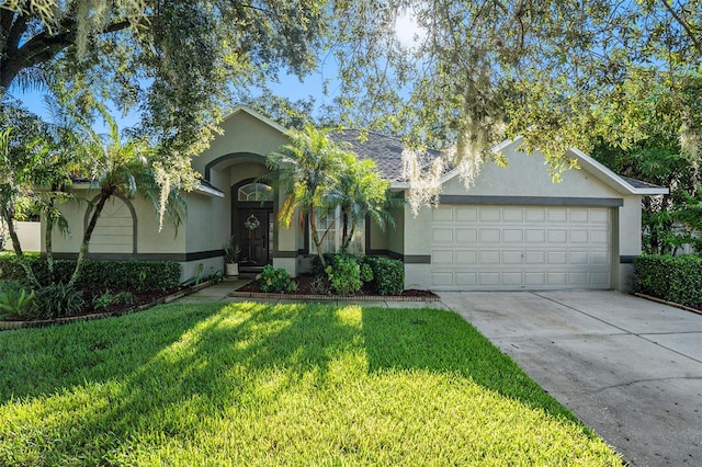 ranch-style home featuring a front yard and a garage