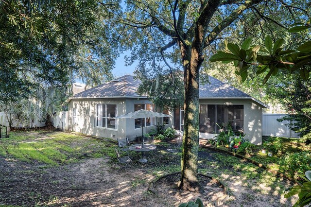 back of house with a sunroom