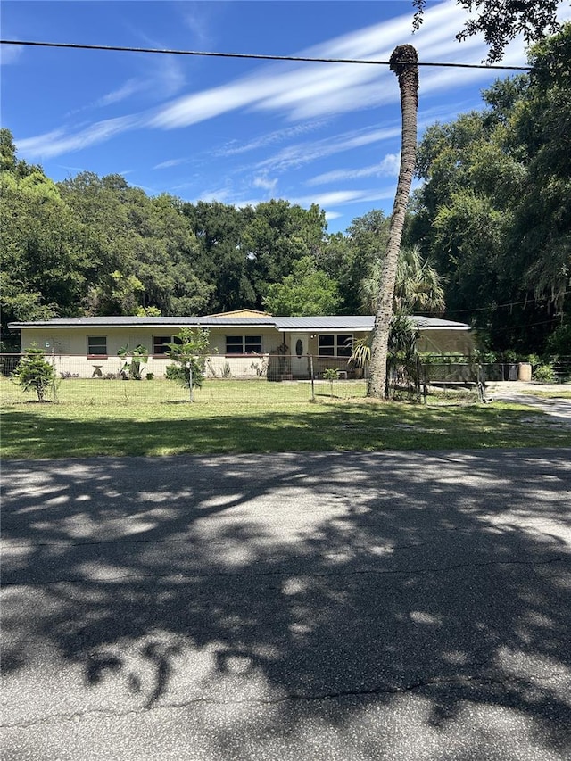 view of front of home with a front lawn