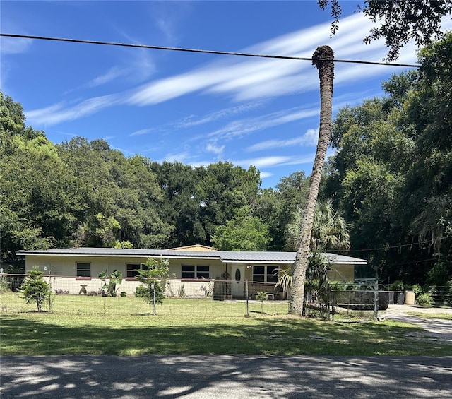 ranch-style house with a front yard